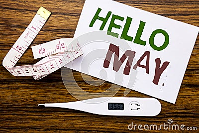 Conceptual hand writing text caption showing Hello May Month. Business concept for Coming Spring Month written on sticky note pape Stock Photo