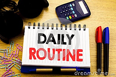 Conceptual hand writing text caption showing Daily Routine. Business concept for Habitual Lifestyle written on notebook book on th Stock Photo