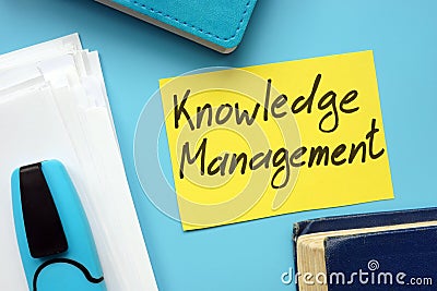 Conceptual hand written text showing Knowledge Management Stock Photo