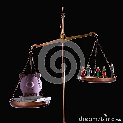 Conceptual image of devaluation of human life and human work. Money outweighs people on mechanical weighing scale Stock Photo