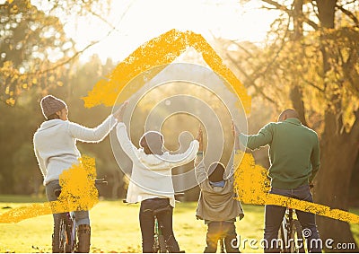 Conceptual image of family on bicycle holding hands on sunny day in park Stock Photo