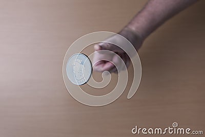 Concept image of flipping a coin. Editorial Stock Photo