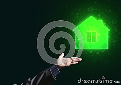 Conceptual image with hand pointing at house or main page icon on dark background Stock Photo