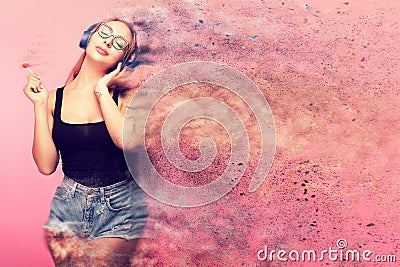 Conceptual image of woman listening to music and holding a Stock Photo