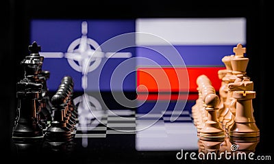 Conceptual image of war between Russia and NATO using chess pieces and national flags Stock Photo