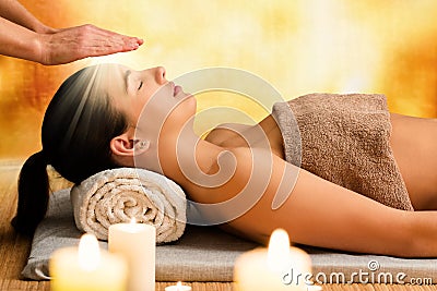 Conceptual image of woman having reiki therapy. Stock Photo