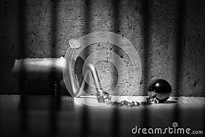 Conceptual jail photo with iron nail ball and chain artistic con Stock Photo