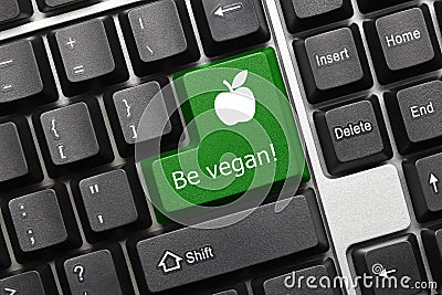 Conceptual keyboard - Be vegan green key with apple symbol Stock Photo