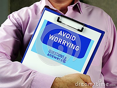 Conceptual photo about AVOID WORRYING with handwritten text Stock Photo