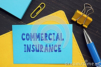 Conceptual photo about COMMERCIAL INSURANCE with handwritten phrase Stock Photo