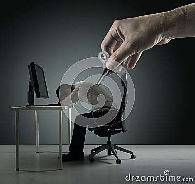 Conceptual portrait of an exhausred office worker being winded up Stock Photo