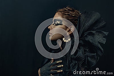 Conceptual portrait of beautiful fashion look woman dark make up Stock Photo