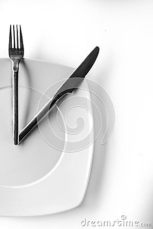 Conceptual time to eat isolated on White Stock Photo