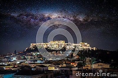 Conceptual view to the illuminated Acropolis of Athens under a starry sky with the milky way Stock Photo