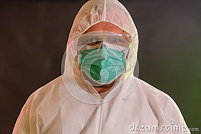 Concerned man in chemical suit Stock Photo