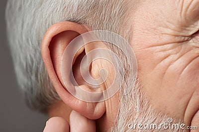 Concerned Man hearing problem closeup. Generate Ai Stock Photo