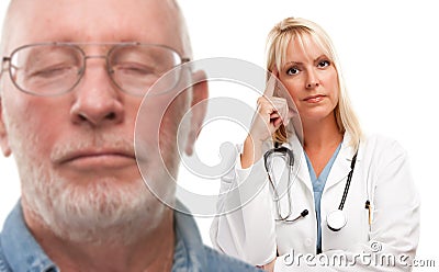 Concerned Senior Man and Female Doctor Behind Stock Photo