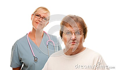 Concerned Senior Woman with Doctor Behind Stock Photo