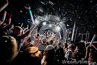 Concert crowd confetti dancing lights Editorial Stock Photo