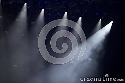 Concert crowd in front of bright stage lights Stock Photo