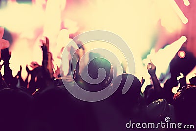 Concert, disco party. People with hands up in night club. Stock Photo