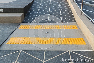 Concert ramp way with stainless steel handrail with disabled sign for support wheelchair disabled people. Stock Photo