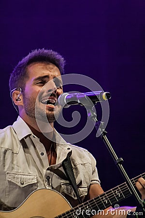 Concert of David Busquets in Tossa de Mar with purple lights. Editorial Stock Photo