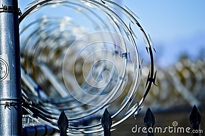 Concertina Wire Stretched Over A Fence Stock Photo