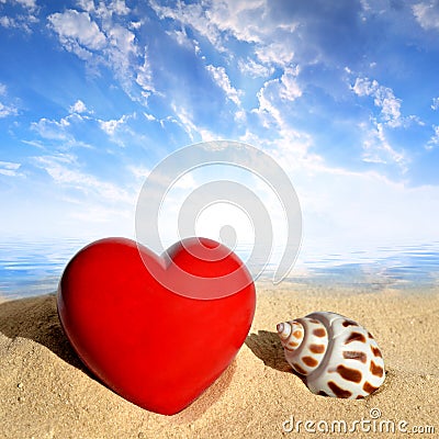 Conch shell with heart on beach Stock Photo