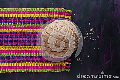 Concha Bread, Mexican Sweet Scone on Woven Tablecloth. Stock Photo