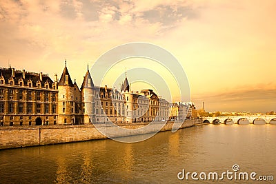 The Conciergerie at Justice Palace and Pont Neuf Bridge over the Seine River, Ile de la Cite, Paris Stock Photo
