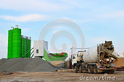 Concrete batching plant. Industrial producing concrete for construction. Heavy mixer concrete trucks Stock Photo