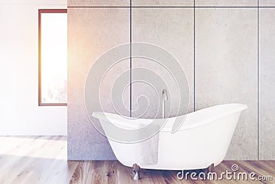 Concrete bathroom, white tub, toned Stock Photo