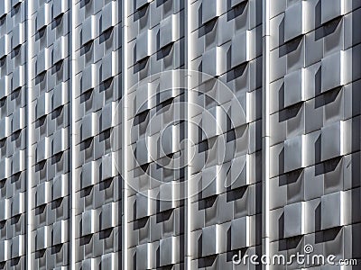 concrete brick wall background with the light and shade on the bricks in group pattern of wave movement extruded from the exterior Stock Photo