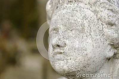 Concrete carved face of an angel Stock Photo
