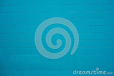 Concrete cinder block wall painted turquoise blue. Stock Photo