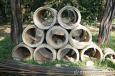 Concrete circle pit in grass on factory yard Stock Photo