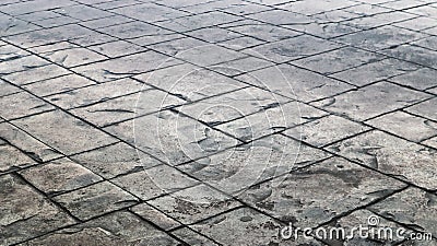 Concrete or cobblestone gray paving slabs or stones for the floor. Pavement in the city. Large gray paving tiles close up Stock Photo