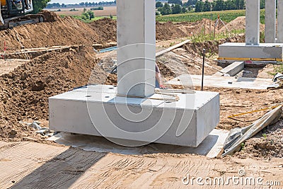 Concrete column is placed on a foundation Stock Photo