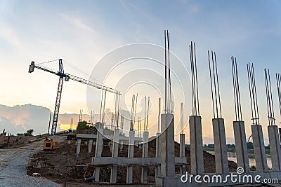 Concrete column structure of the retaining wall and Construction crane for laying large steel pipes for drinking water project Stock Photo