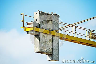 Concrete counterweights of an urban metal crane for the construction of buildings Stock Photo