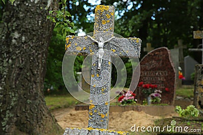 Concrete cross with a crucifix Stock Photo
