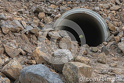 Concrete drain pipe under the ground Stock Photo
