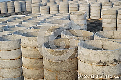 Concrete drainage pipes for industrial building construction, irrigation and well making Stock Photo