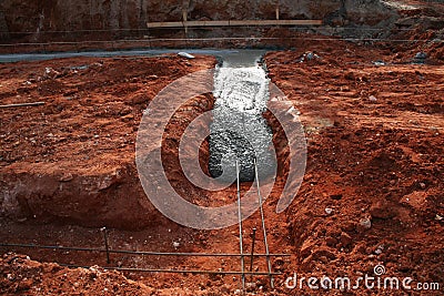 Concrete footer being poured Stock Photo