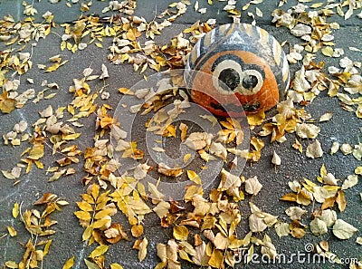 Concrete hemisphere for fencing parking cars in the form of a Colorado smiling beetle on asphalt covered Stock Photo