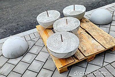 Installation of concrete hemispheres on the sidewalk Stock Photo