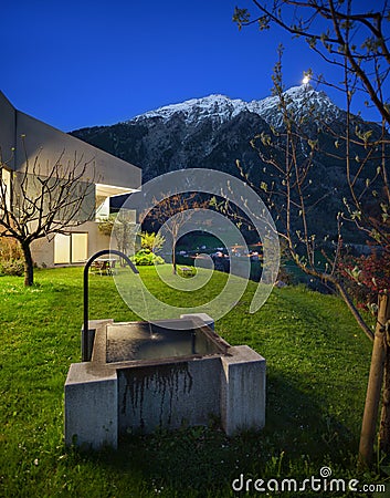 Concrete house with stone fountain Stock Photo