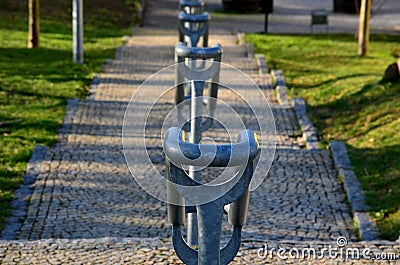 Concrete long staircase with long and short pieces of stairs and ramps made of cobblestone granite paving blocks. packing short ga Stock Photo