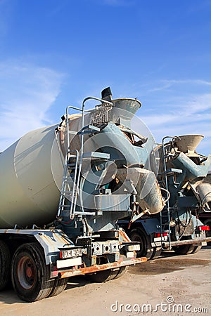 Concrete mixer two trucks rear view grunge Stock Photo